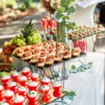 Large assortment of appetizers for an event in restaurant. Glass food stand